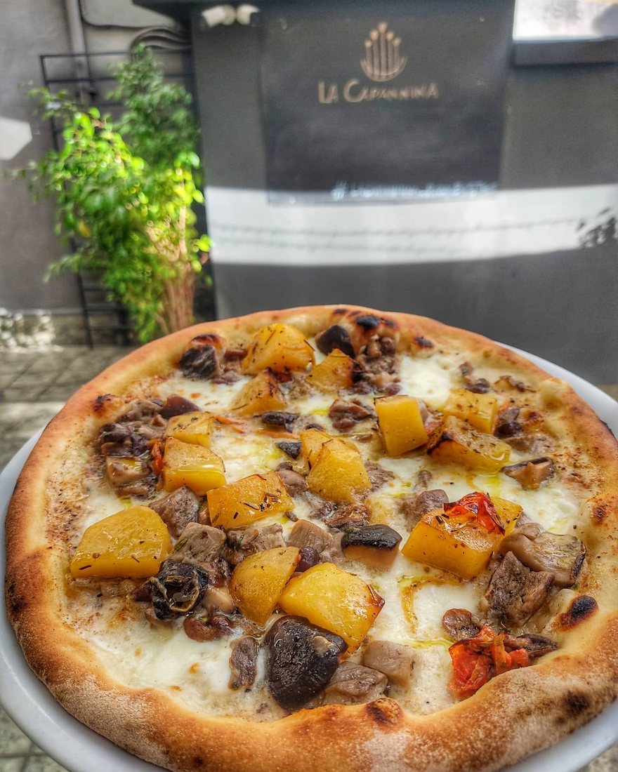 A pizza served at the table