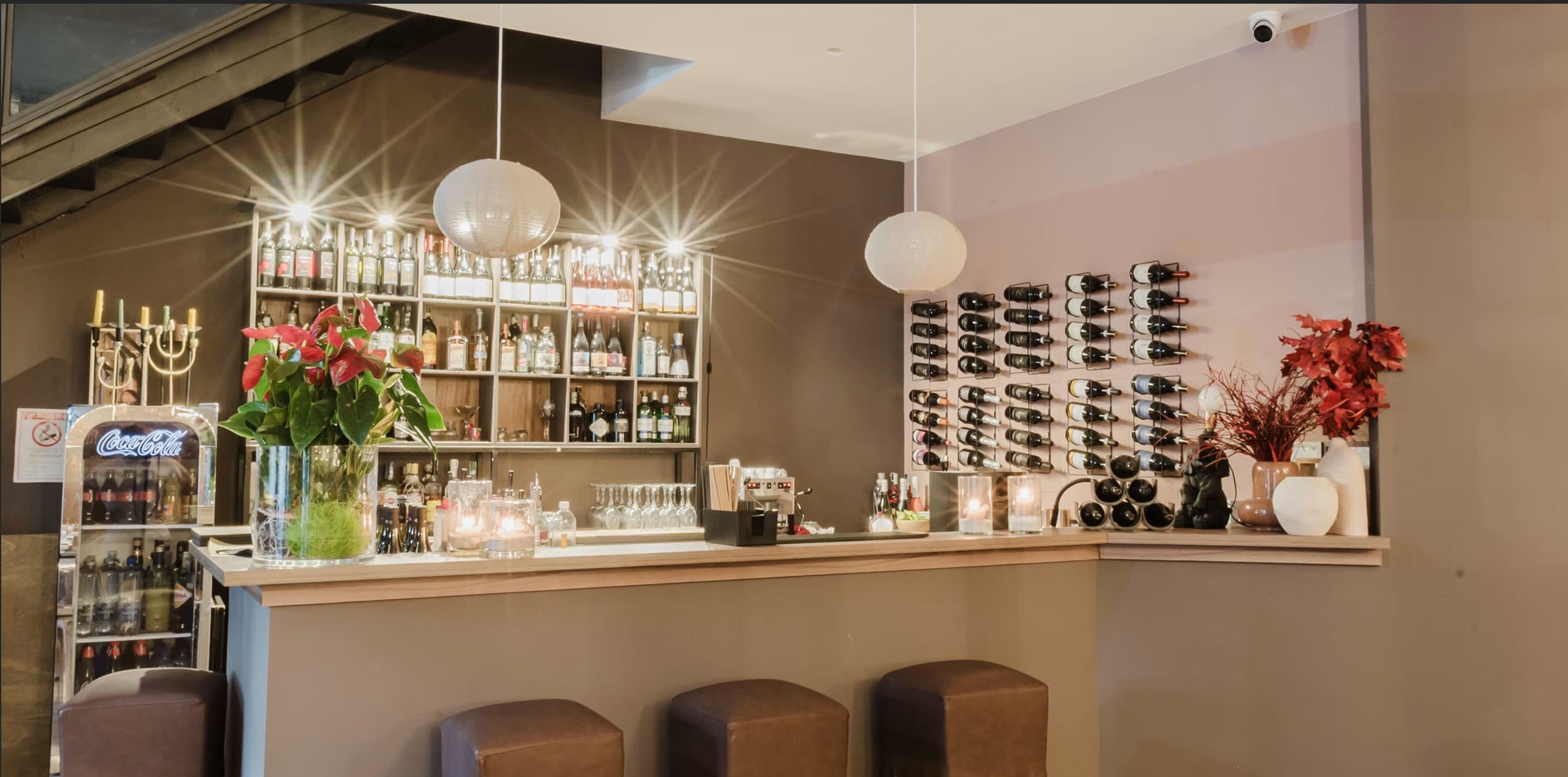 The bar counter with its wall of bottles and racked labels